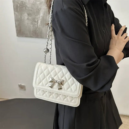 Lumiere Quilted Crossbody – Structured Diamond-Stitched Handbag with Metallic Bow Accent