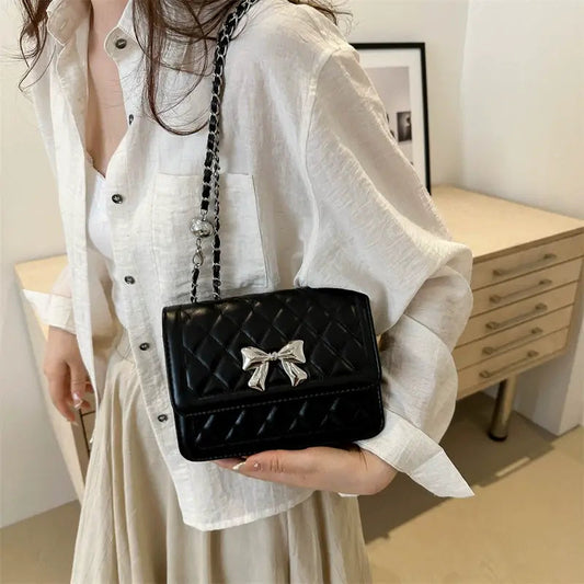 Lumiere Quilted Crossbody – Structured Diamond-Stitched Handbag with Metallic Bow Accent